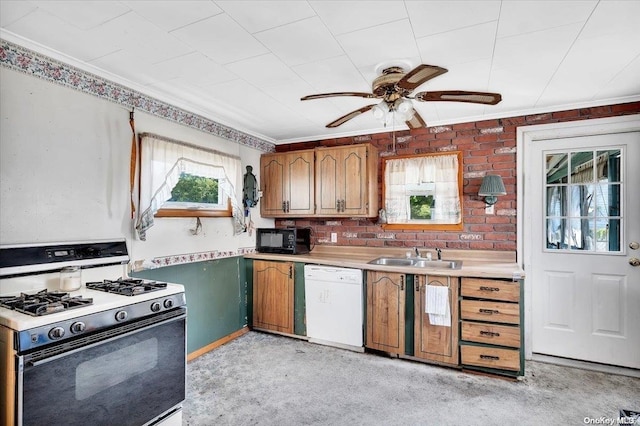 kitchen with light carpet, gas range, ceiling fan, sink, and dishwasher