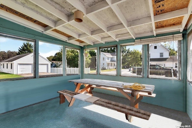 sunroom featuring vaulted ceiling