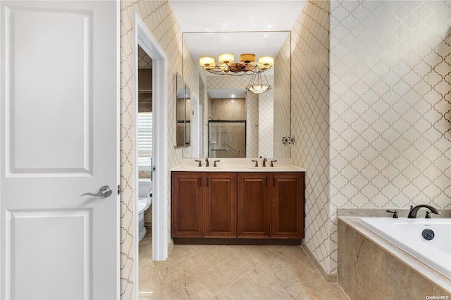 full bathroom with vanity, an inviting chandelier, tile patterned floors, separate shower and tub, and toilet