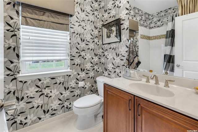 bathroom with tile patterned floors, toilet, vanity, and a shower with shower curtain