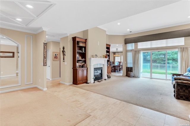 living room with light colored carpet and ornamental molding