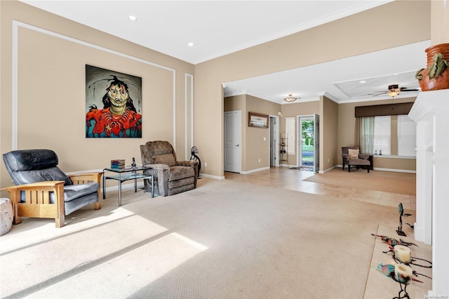 sitting room with crown molding, ceiling fan, and light colored carpet