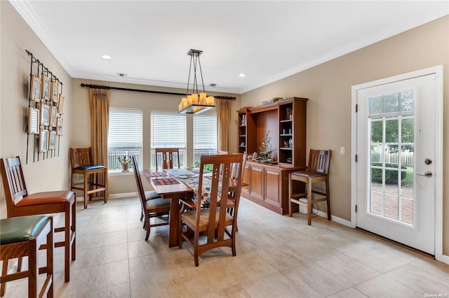 tiled dining area featuring crown molding