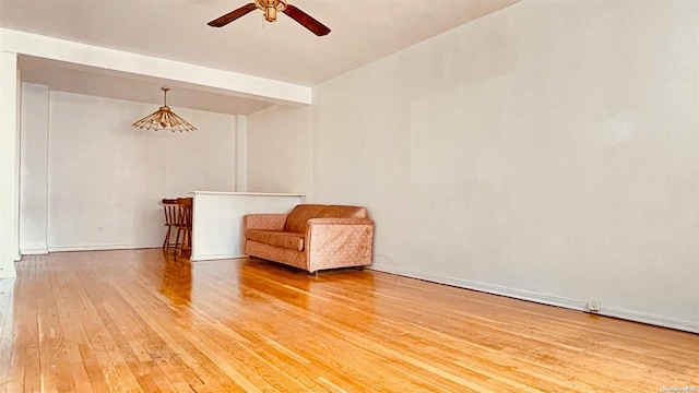 unfurnished room with hardwood / wood-style floors and ceiling fan