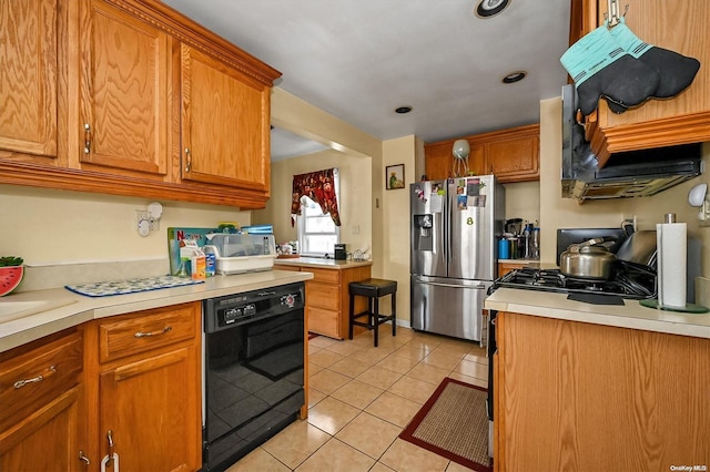 kitchen with dishwasher, light tile patterned floors, and stainless steel refrigerator with ice dispenser