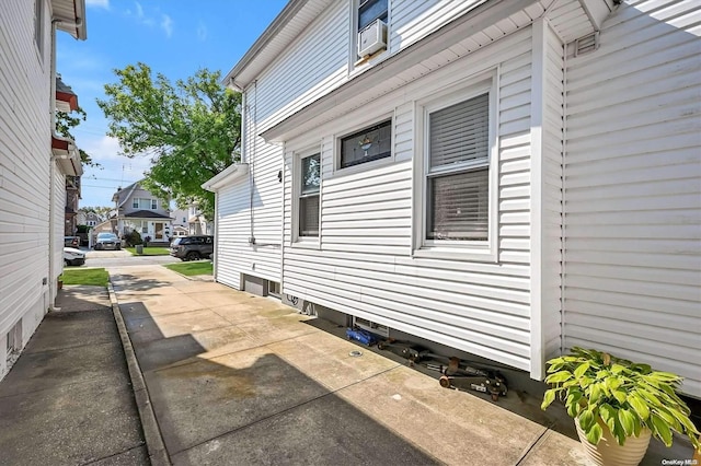 view of side of home with a patio area