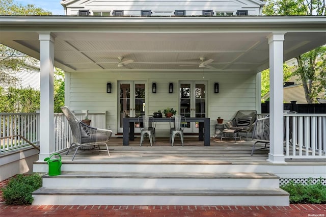 wooden terrace featuring a porch and ceiling fan