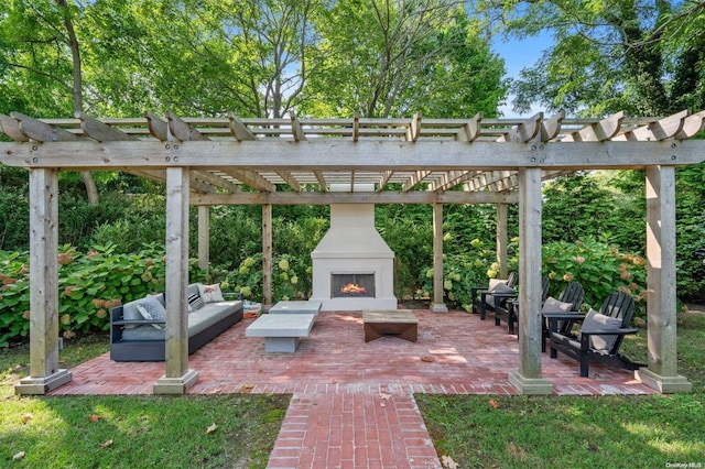 view of patio featuring an outdoor living space with a fireplace and a pergola