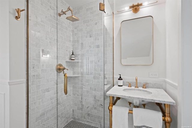 bathroom with walk in shower and sink