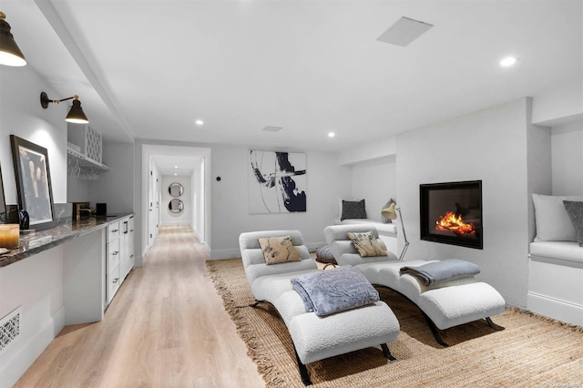 living room with light hardwood / wood-style flooring