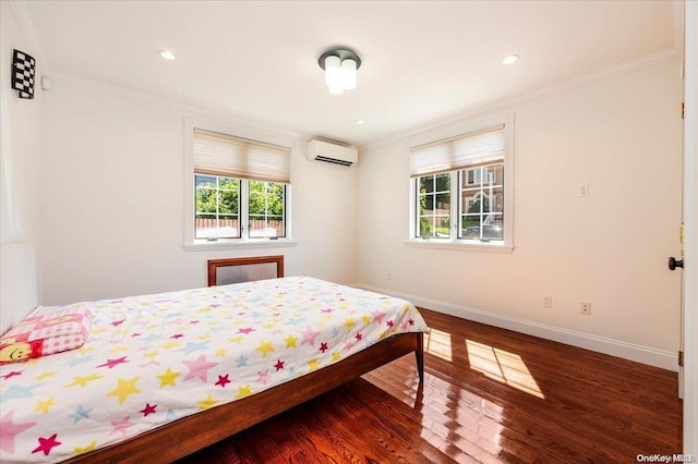 bedroom featuring a wall mounted air conditioner, dark hardwood / wood-style flooring, and ornamental molding