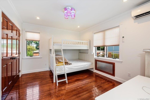 bedroom featuring a wall unit AC, dark wood-type flooring, and crown molding