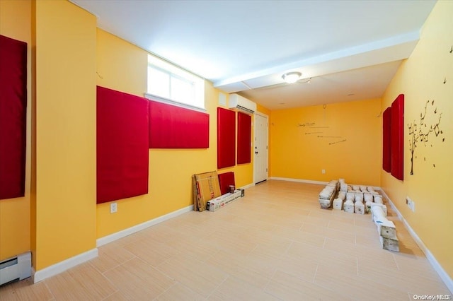 interior space featuring a baseboard radiator and an AC wall unit