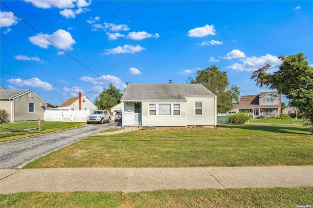 bungalow with a front yard