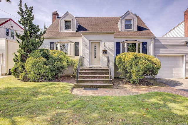 cape cod home featuring a front yard