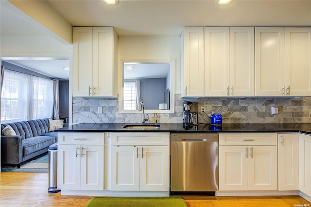 kitchen with dishwasher, sink, plenty of natural light, and light hardwood / wood-style flooring