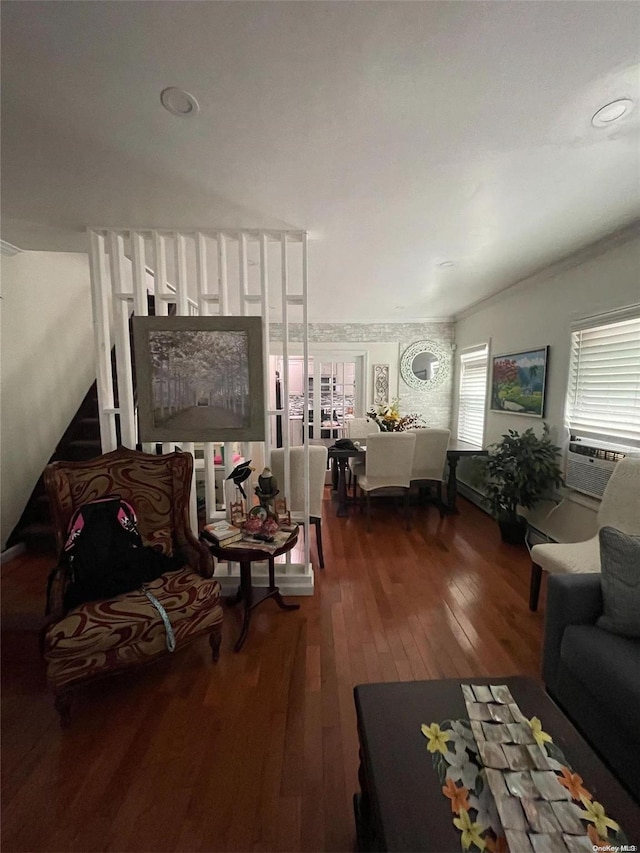 living room with cooling unit and hardwood / wood-style flooring