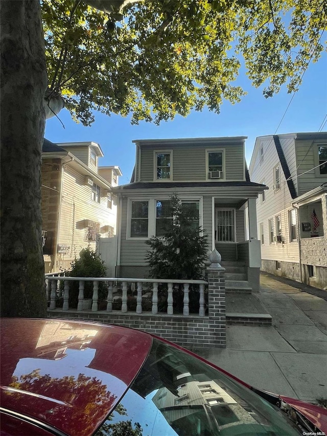 rear view of house with a porch