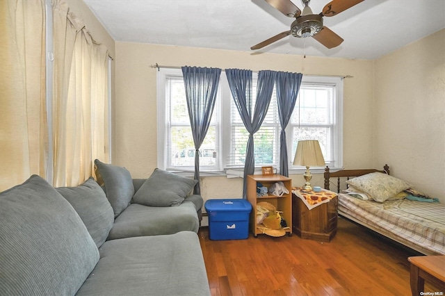 interior space with ceiling fan and hardwood / wood-style floors