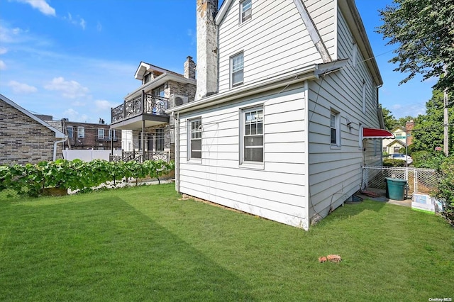 rear view of property with a yard