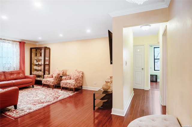 living room with crown molding and dark hardwood / wood-style flooring