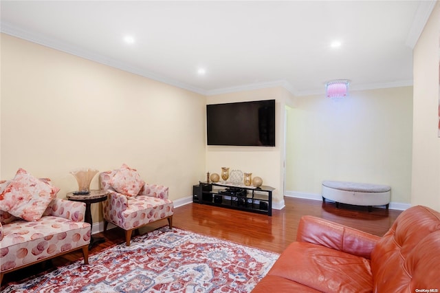 living room with hardwood / wood-style flooring and ornamental molding