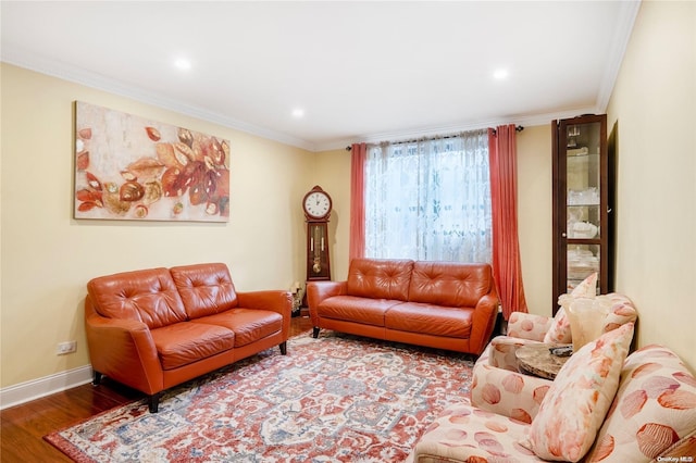 living room with hardwood / wood-style flooring and ornamental molding