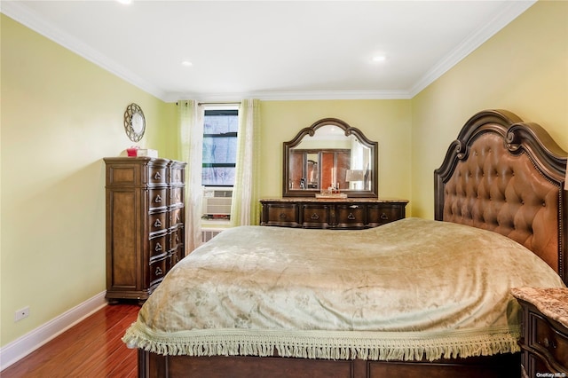 bedroom featuring dark hardwood / wood-style floors, cooling unit, and ornamental molding