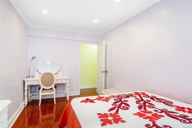 bedroom featuring dark hardwood / wood-style flooring and ornamental molding