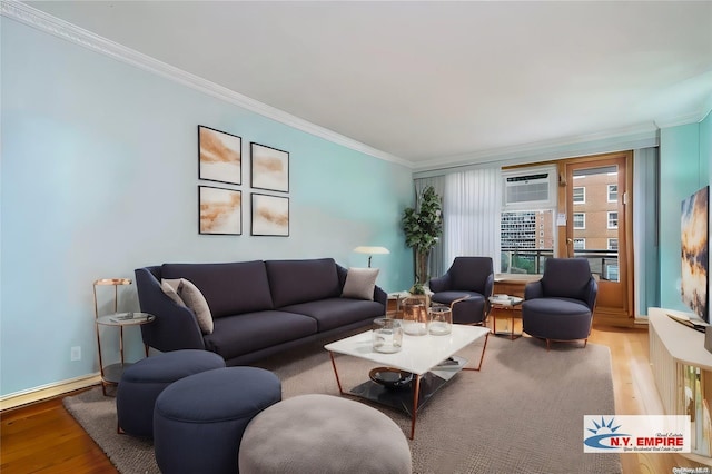 living room featuring an AC wall unit, ornamental molding, and hardwood / wood-style flooring