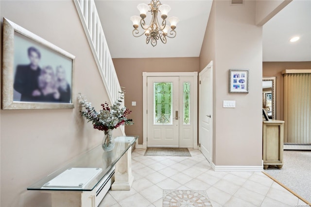 entryway with a chandelier and baseboard heating