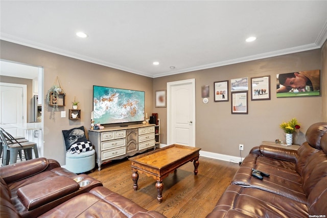 living room featuring ornamental molding and hardwood / wood-style flooring