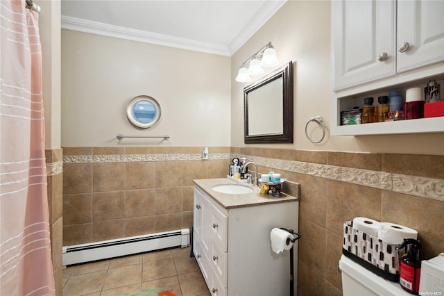 bathroom with tile patterned flooring, vanity, tile walls, and a baseboard heating unit