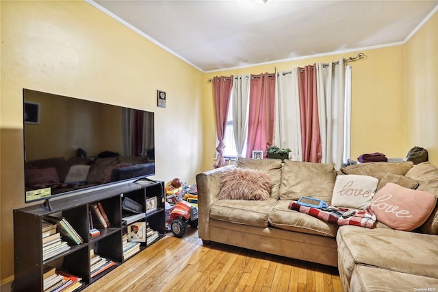 living room with ornamental molding and light wood-type flooring