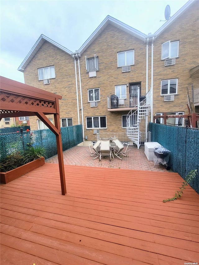 wooden terrace featuring a patio