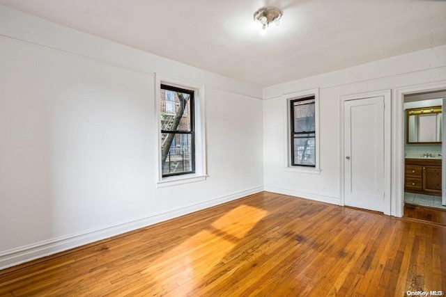 unfurnished room featuring hardwood / wood-style floors