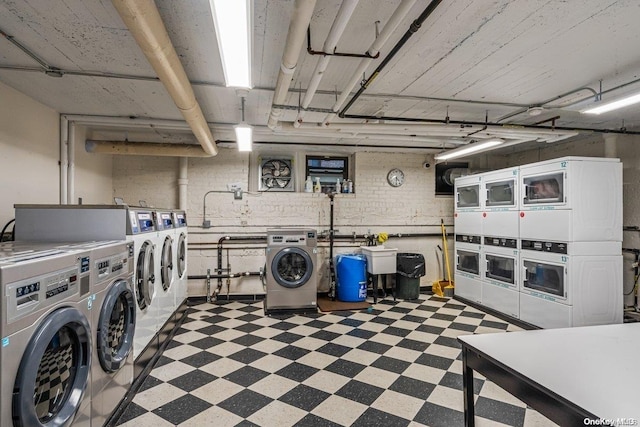 laundry area featuring washing machine and dryer and stacked washer and dryer