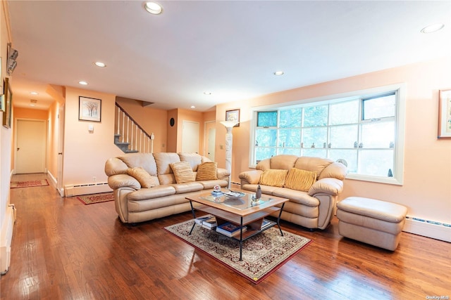 living room featuring hardwood / wood-style flooring and a baseboard heating unit