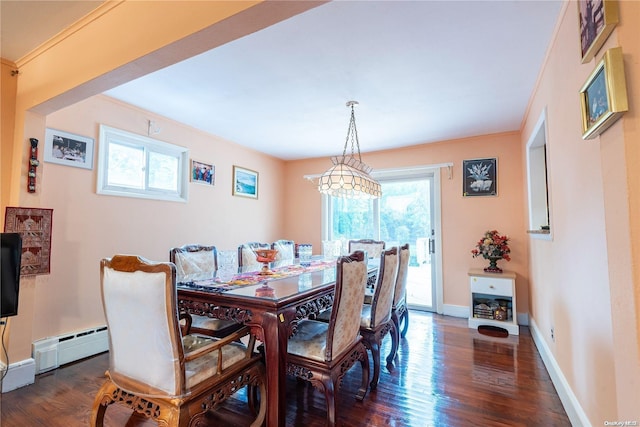 dining space with dark hardwood / wood-style floors and a baseboard heating unit