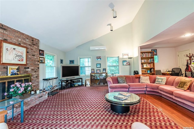 living room with wood-type flooring, high vaulted ceiling, and a wall mounted AC