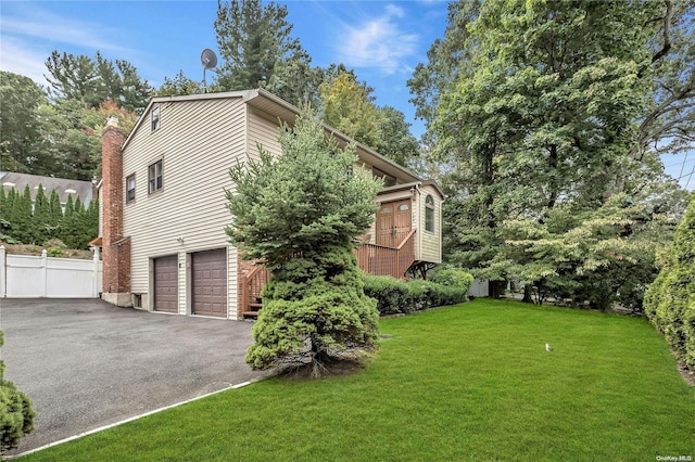 exterior space with a lawn and a garage