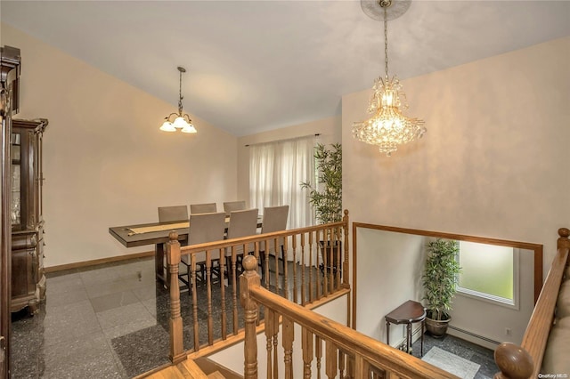 interior space featuring a chandelier, vaulted ceiling, and baseboard heating