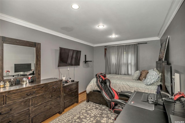 bedroom with light hardwood / wood-style flooring and ornamental molding