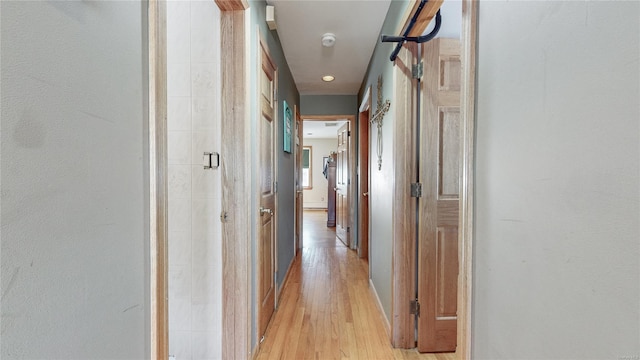 corridor featuring light hardwood / wood-style flooring