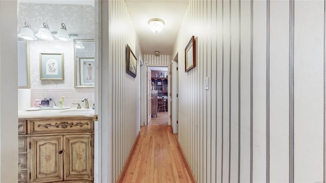 hall with light hardwood / wood-style flooring