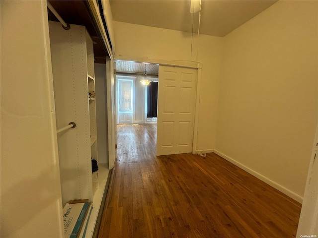 hallway featuring dark wood-type flooring