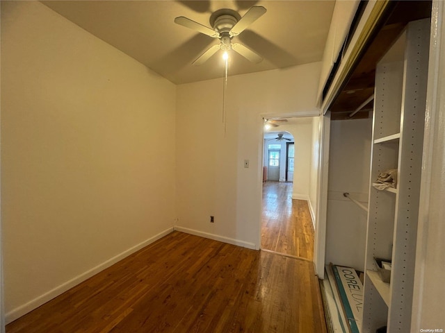 unfurnished room featuring ceiling fan and dark hardwood / wood-style flooring