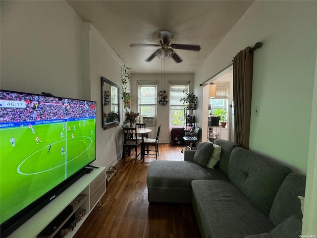 living room featuring dark hardwood / wood-style flooring, ceiling fan, and cooling unit