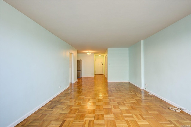 empty room with light parquet floors