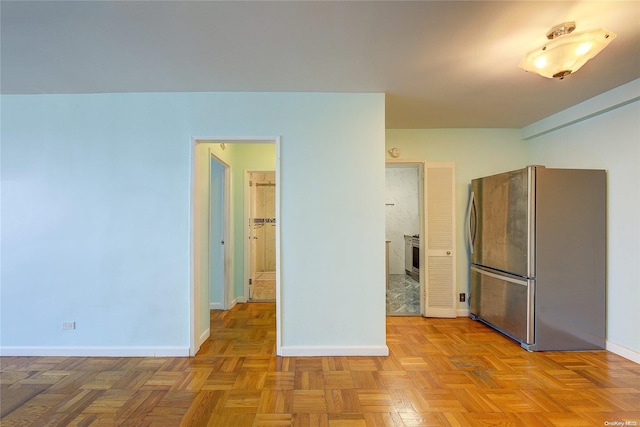 kitchen featuring stainless steel fridge and light parquet floors